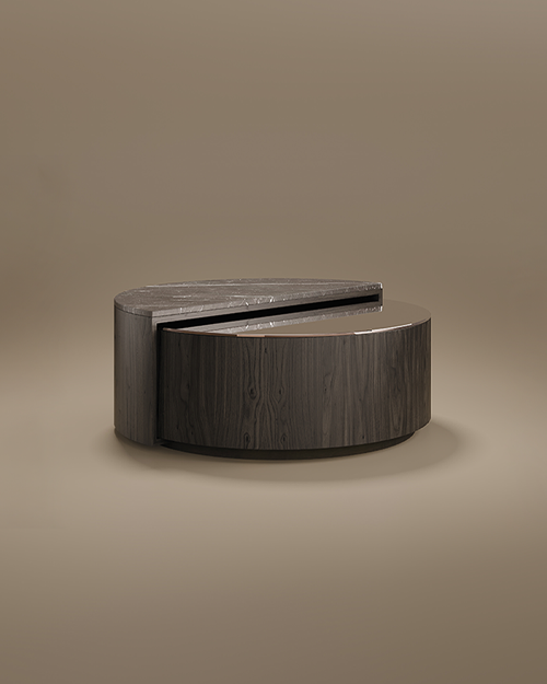 A sleek, circular Westinghouse Center Table by Porus Studio, featuring a tiered, split-level design. The top semi-circle is made of grey Kenzo marble with white veining, while the lower, slightly offset tier features a smoked mirror surface. The cylindrical body is crafted from dark-stained ash wood with a visible grain, separated by a thin brushed brass accent. The table is set against a minimalist, warm taupe background with soft studio lighting.