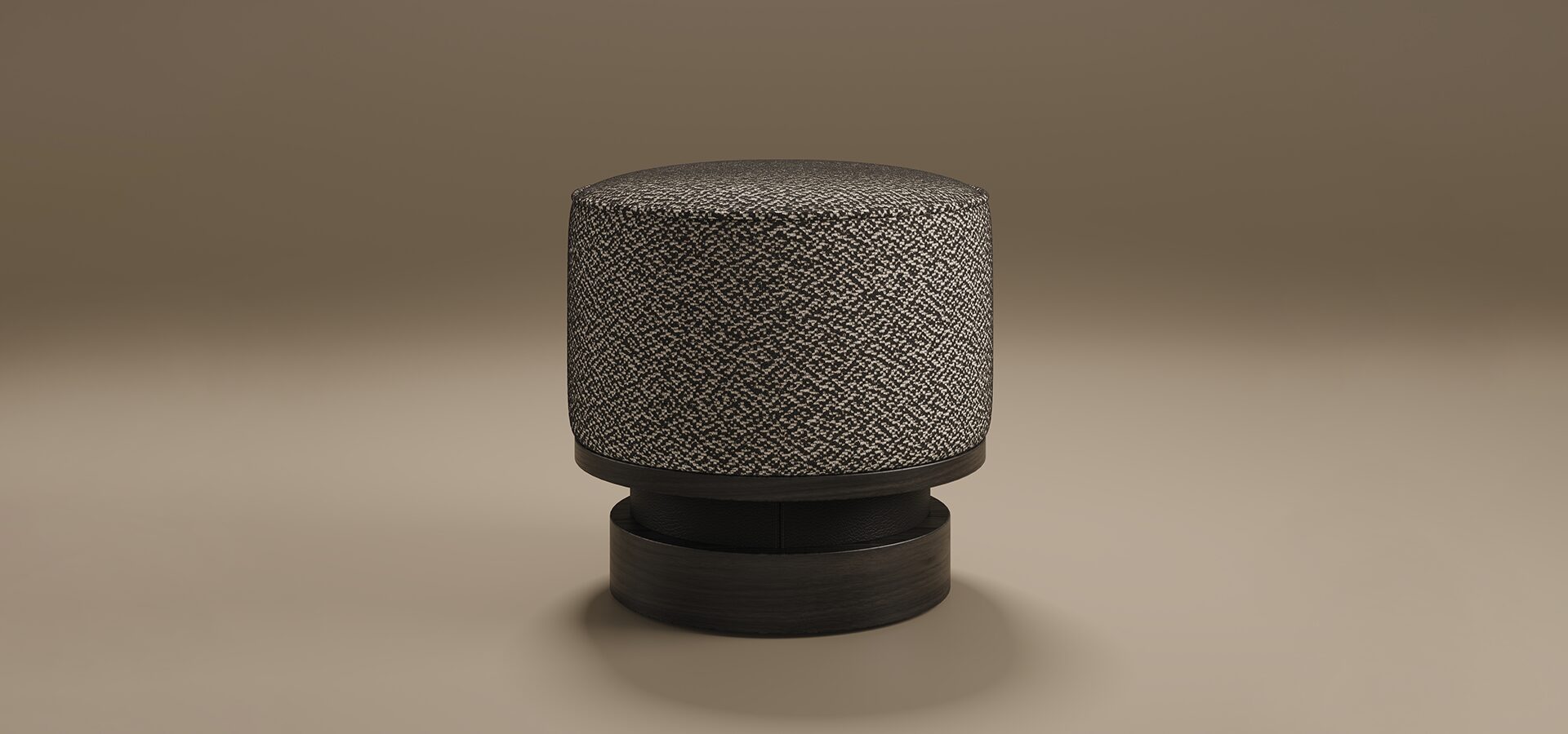 Minimalist studio shot of the Wyo Stool by Porus Studio set against a warm, neutral taupe background. The stool features a thick, cylindrical cushioned seat upholstered in a high-contrast black and white textured fabric. It is supported by a sculptural, tiered pedestal base made of dark, matte-finished wood, creating a sophisticated and grounded silhouette.