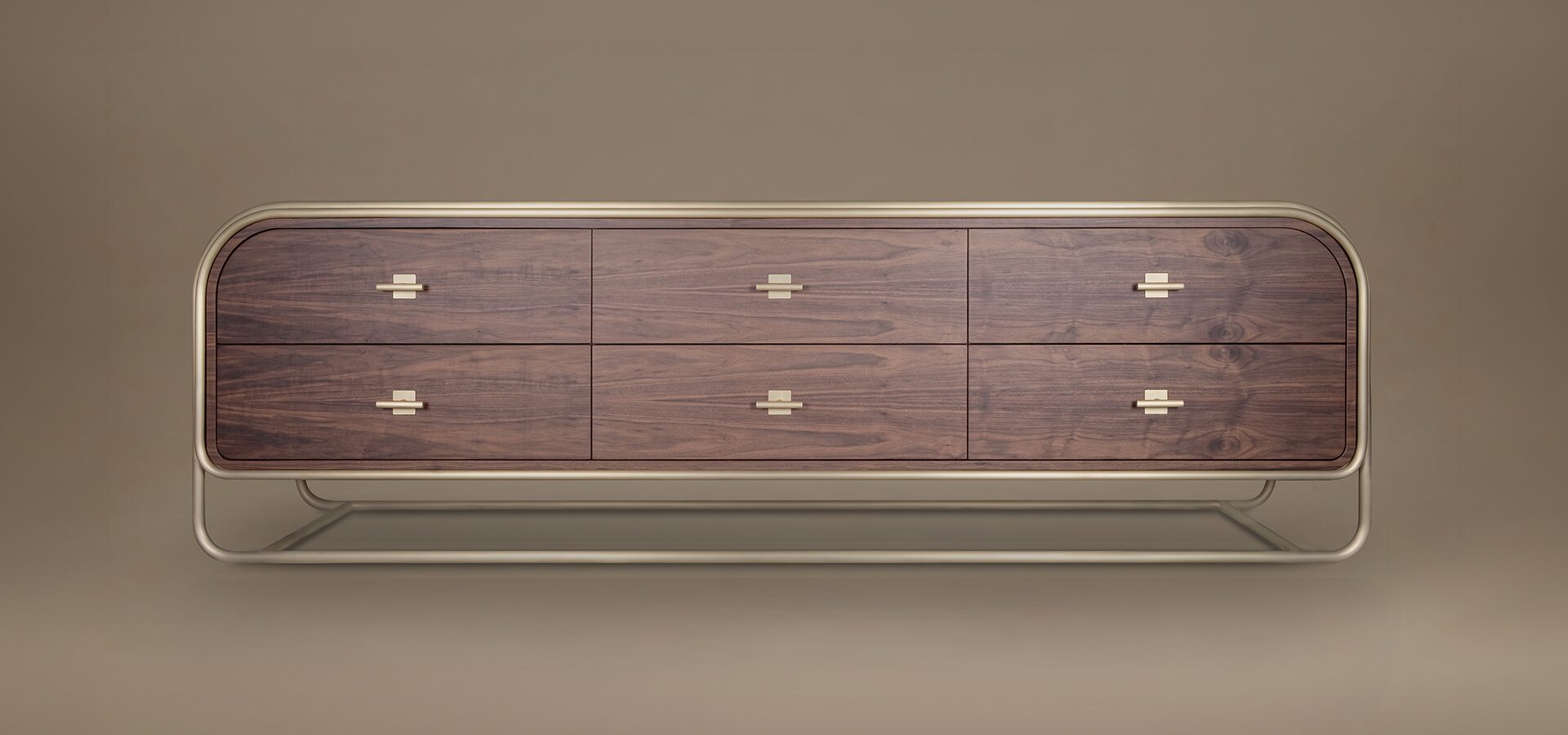 A front-facing lifestyle rendering of the Columbia Sideboard in dark walnut wood and a soft gold frame. The piece is set against a matching monochrome brownish-tan studio backdrop, highlighting its symmetrical six-drawer layout.