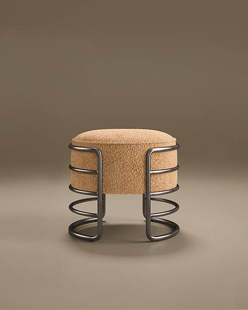 Contemporary Eero Stool with a thick, cylindrical seat upholstered in a textured camel-colored bouclé fabric. The seat is cradled by a minimalist gunmetal-finished frame consisting of horizontal curved bars that form a cage-like structure and transition into a circular base.