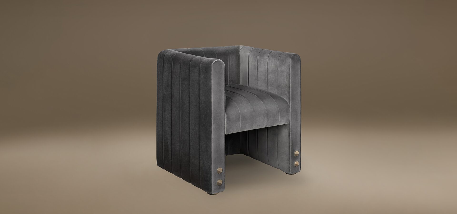 Modern Inglewood Dining Chair by Porus Studio, featuring a fully upholstered cubic design in grey velvet with vertical channel tufting and decorative gold stud details at the base.