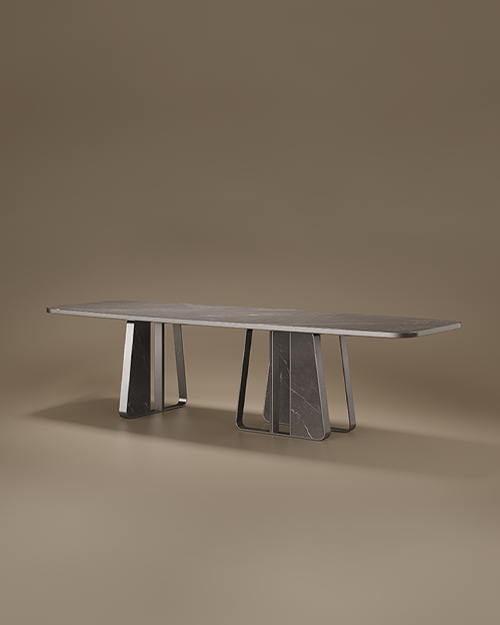 Modern Kenai Dining Table by Porus Studio featuring a rectangular Grey Kendzo marble top and asymmetric gunmetal stainless steel legs against a neutral studio background.