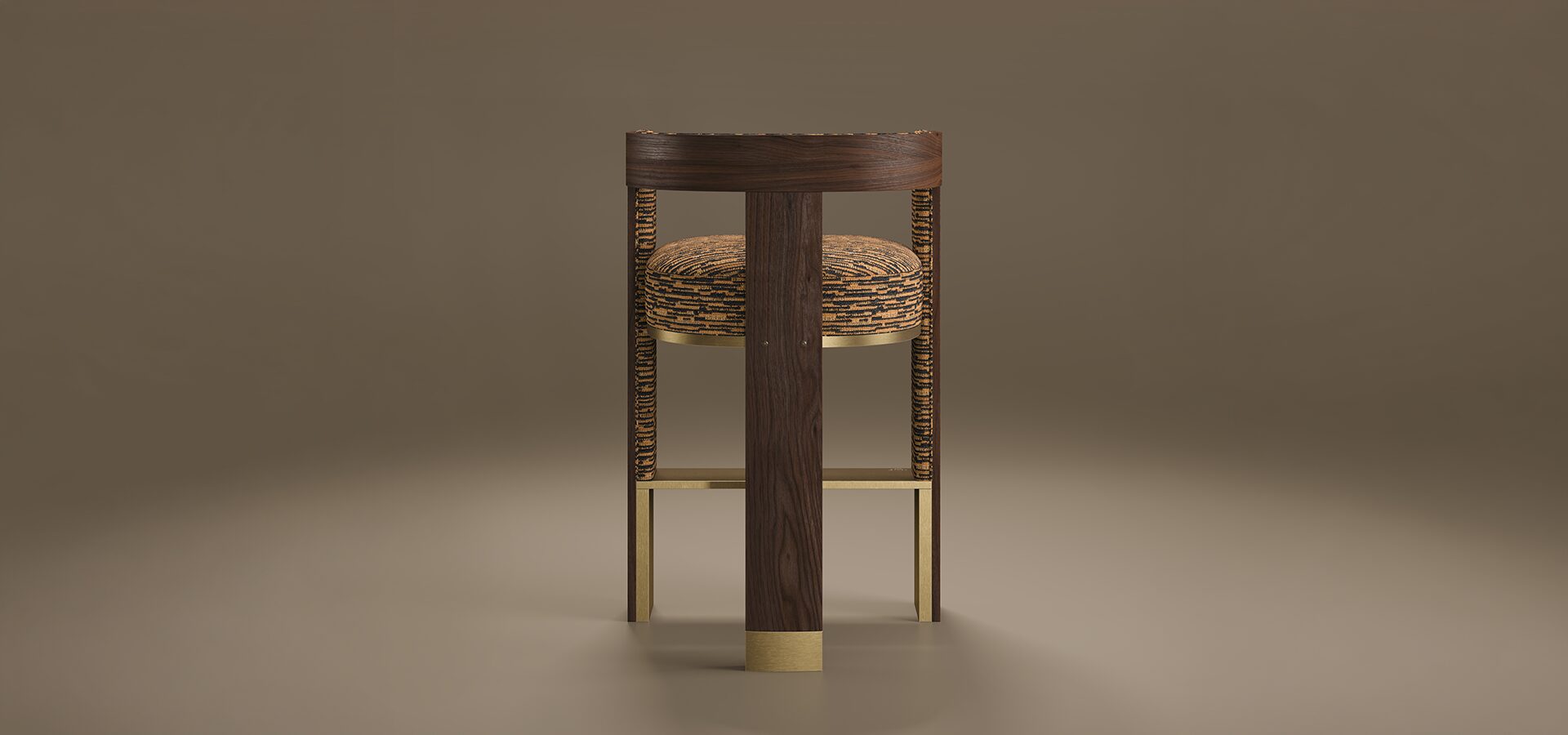 A rear-view studio shot of the Brooklyn Bar Chair by Porus Studio, a modern furniture piece inspired by the iconic architecture of the Brooklyn Bridge. The chair features a prominent, vertical central spine made of dark walnut wood with a rich grain, accented at the base with a brushed brass cuff. This wooden structure supports a curved backrest and a thick, rounded seat upholstered in a textured orange and black patterned fabric. The side supports and horizontal footrest are crafted from polished brass, creating a geometric, industrial-chic silhouette. The chair is set against a neutral, warm taupe background with soft reflections on the floor.