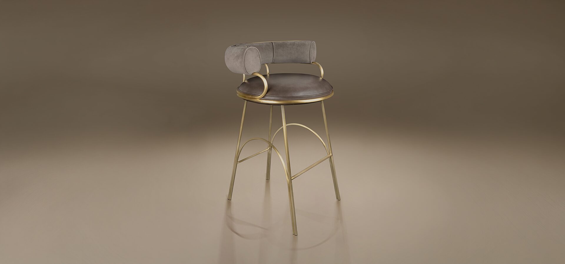 A contemporary bar chair (Austin Bar Chair by Porus Studio) with a distinct Art Deco flair, set against a smooth, warm taupe studio background. The chair features a striking metal frame made of polished, warm brass-finished steel, with slender legs and arched supports that serve as footrests.
