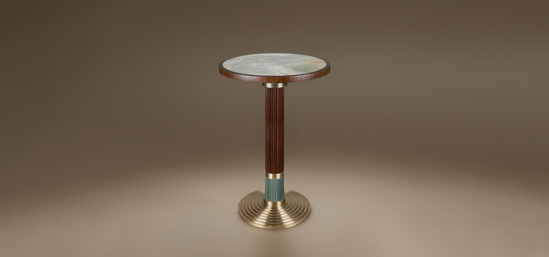 The Queens Bar Table by Porus Studio, featuring a round marble tabletop and a fluted wood and metal pedestal base.