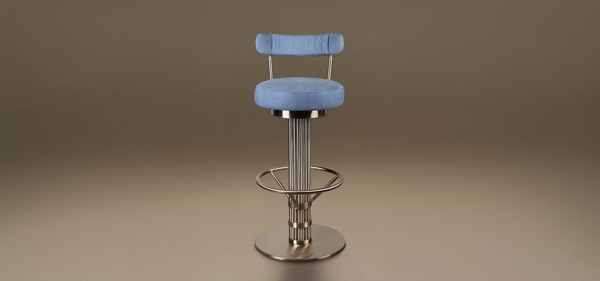 Willis Bar Chair A luxury Willis Bar Chair featuring a cylindrical fluted base in Stainless Steel and a circular footrest. The seat and slender ribbed backrest are upholstered in Leather. Set against a neutral taupe background.