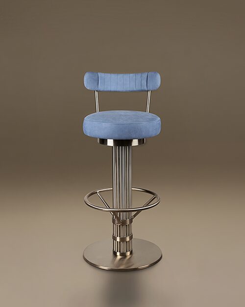 A luxury Willis Bar Chair featuring a cylindrical fluted base in Stainless Steel and a circular footrest. The seat and slender ribbed backrest are upholstered in Leather. Set against a neutral taupe background.