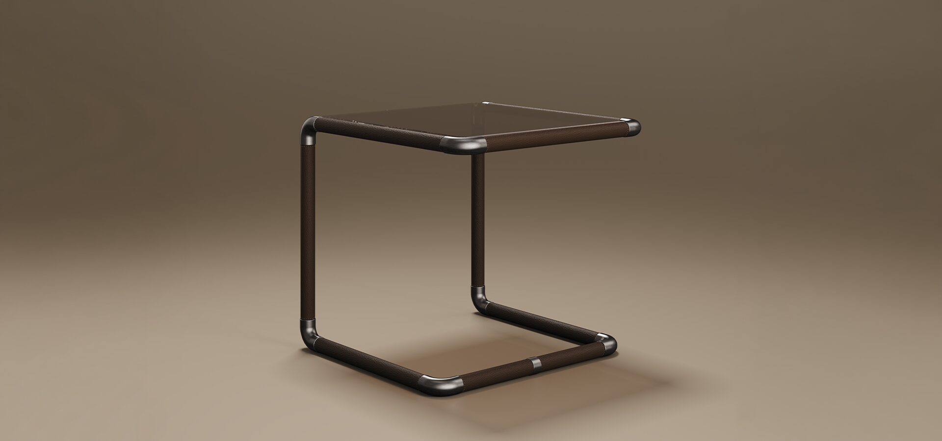 Dickson Side Table A luxury Dickson Side Table by Porus Studio featuring a minimalist, C-shaped tubular frame. The square tabletop is made of bronze glass, set into a frame wrapped in dark brown leather. The rounded corner joints are finished in aged brushed brass. This industrial-chic piece is shown from a side angle against a warm, neutral studio background.