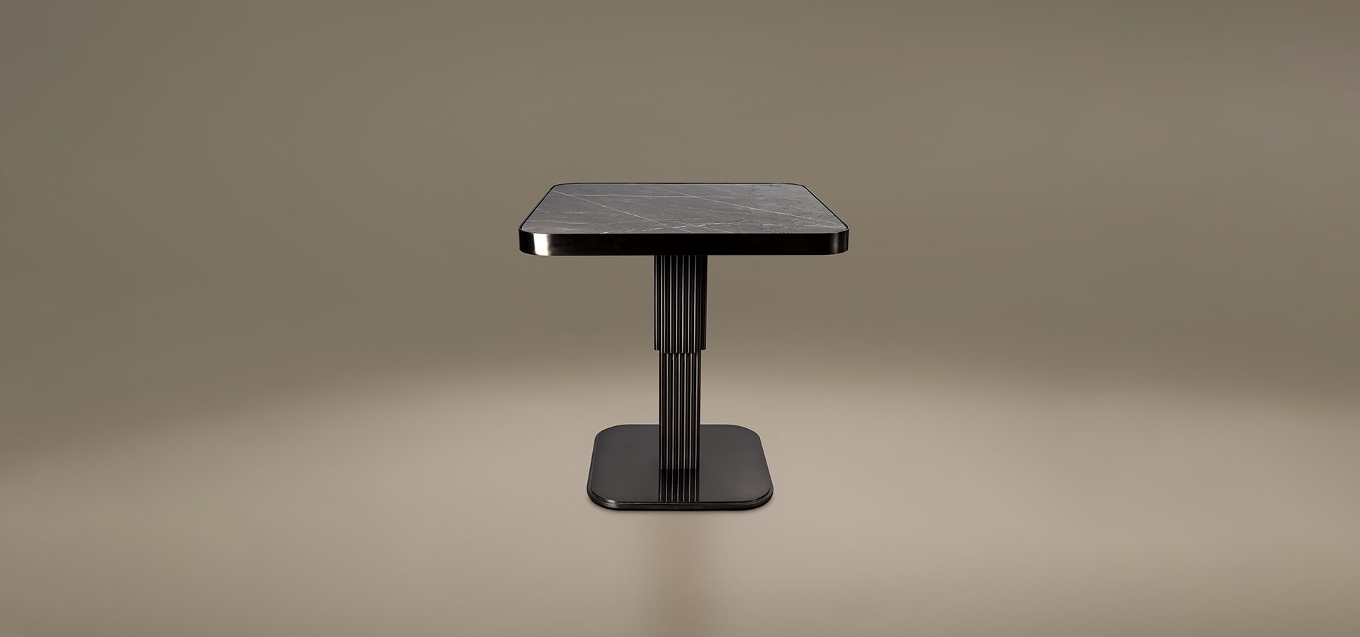 Staten Dining Table by Porus Studio a luxury square table with a grey marble top and a ribbed stainless steel pedestal base