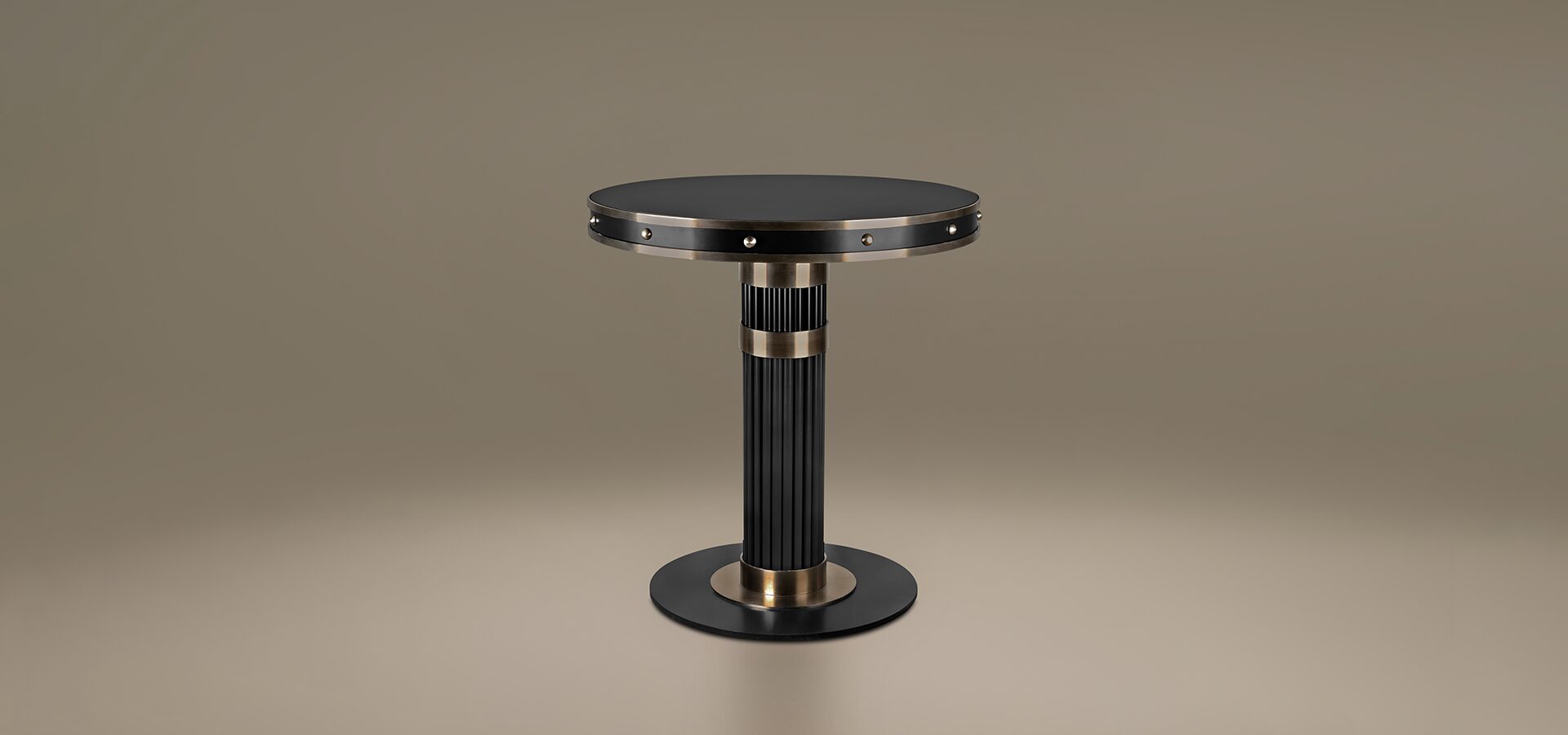 Willis Dining Table by Porus Studio. A sophisticated black and champagne gold pedestal table with a lacquered metal structure and glass top, designed with architectural influences from Chicago’s Willis Tower.