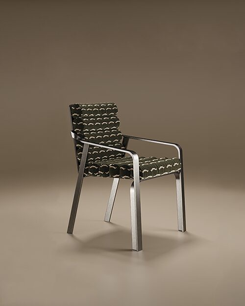 The Ohio Dining Chair featuring a sleek industrial steel frame with integrated armrests and a unique ribbed upholstery in dark patterned fabric.