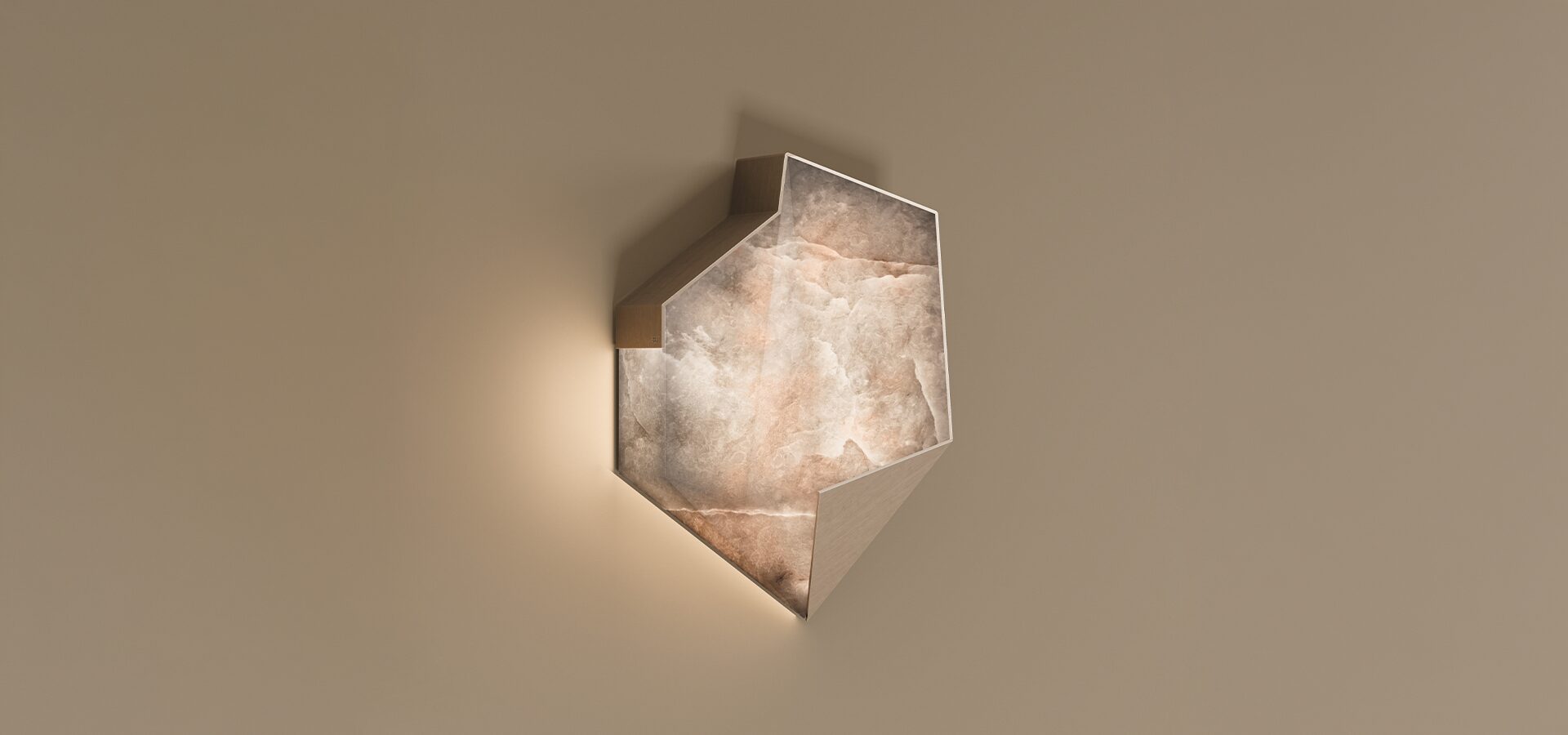 Modern Denali Wall Lamp by Porus Studio, featuring an angular geometric shape and a translucent alabaster surface with natural stone textures, glowing with warm light against a neutral wall.