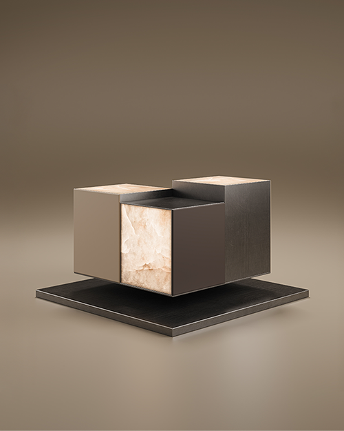 A luxury Hudson Side Table by Porus Studio, featuring an architectural design of three staggered, "floating" cubes. One cube is made of translucent white alabaster, while the others are finished in dark matte lacquer and metal. The piece is set against a neutral, warm-toned studio background.