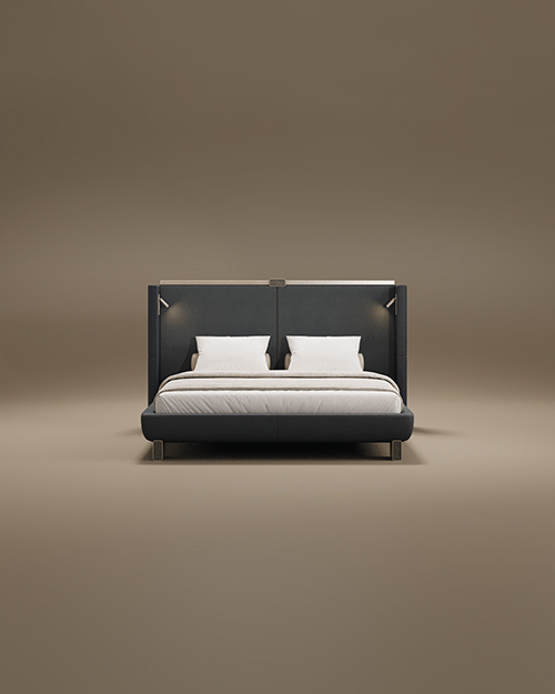 The Broadway Bed features a grand, high-profile headboard with integrated wingback sides and built-in reading lights. Upholstered in a sophisticated dark fabric, the design is topped with a sleek metallic trim and sits on minimalist rectangular metal feet. The bed is styled with crisp white pillows and neutral bedding, presented against a warm, seamless taupe background.