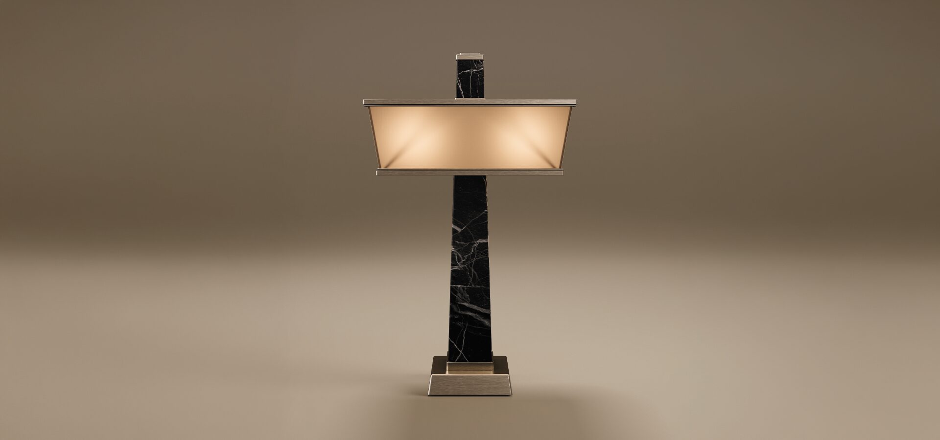 Liberty Table Lamp by Porus Studio. An architectural table lamp inspired by the Statue of Liberty's torch, featuring a tall, tapering obelisk structure made of marble. The design is complemented by a wide, rectangular shade and accents crafted in brushed stainless steel, including a sturdy square base. The lamp features a frosted glass diffuser that emits a warm glow, presented against a minimal taupe background.