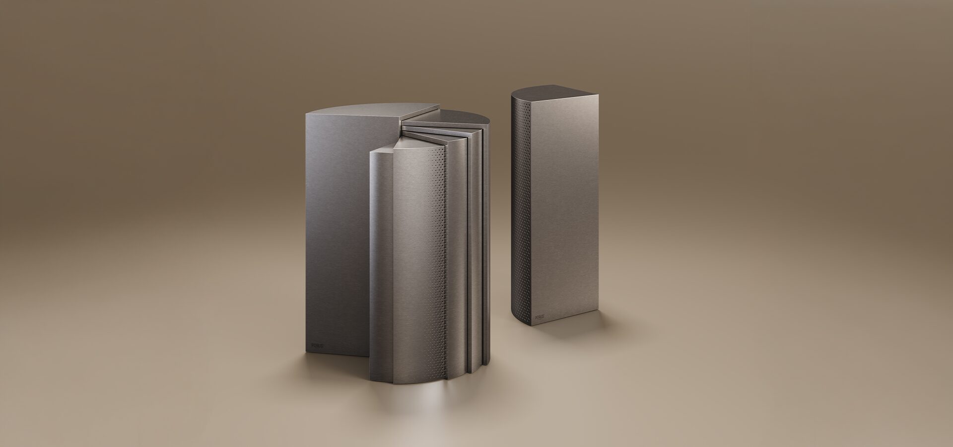 A luxury Seagram Side Table set by Porus Studio, featuring two modular, wedge-shaped units with an architectural design. The pieces are finished in a silver metal, with one unit showing a smooth face and the other displaying a decorative vertical fluted pattern. The metallic, monolithic tables are inspired by skyscraper architecture and are set against a warm, neutral studio background.