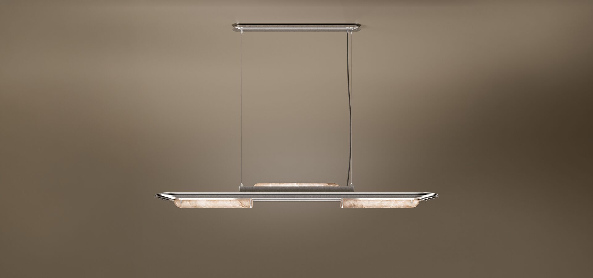 The Chrysler Suspension Lamp by Porus Studio, a luxury horizontal chandelier inspired by Art Deco architecture. It features a sleek brushed brass or silver-toned frame with aerodynamic, tiered edges reminiscent of skyscrapers. The fixture incorporates cylindrical diffusers made of backlit alabaster or translucent stone, emitting a soft, warm glow. It is suspended by two thin cables from a matching canopy against a dark, neutral backdrop.