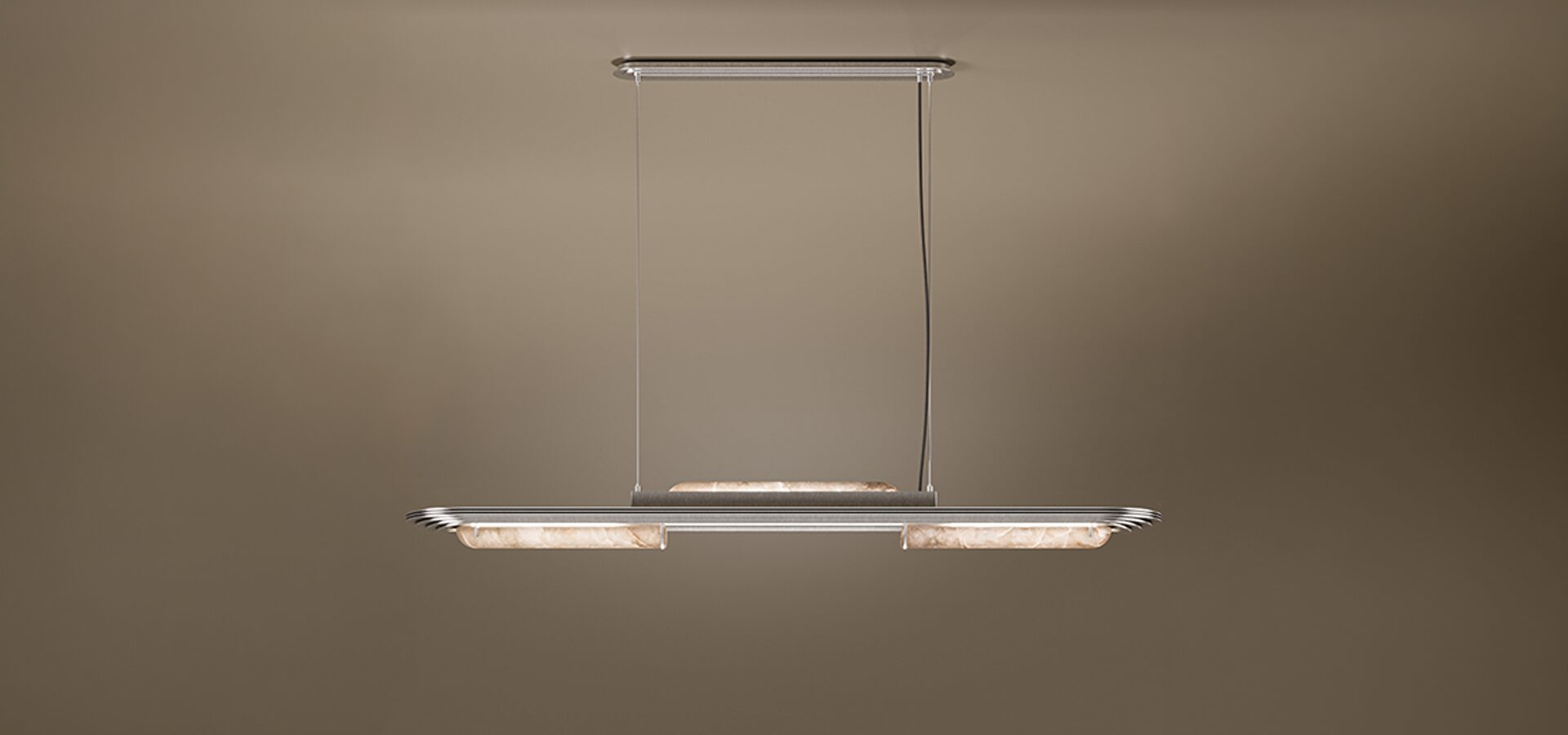 The Chrysler Suspension Lamp by Porus Studio, a luxury horizontal chandelier inspired by Art Deco architecture. It features a sleek brushed brass or silver-toned frame with aerodynamic, tiered edges reminiscent of skyscrapers. The fixture incorporates cylindrical diffusers made of backlit alabaster or translucent stone, emitting a soft, warm glow. It is suspended by two thin cables from a matching canopy against a dark, neutral backdrop.