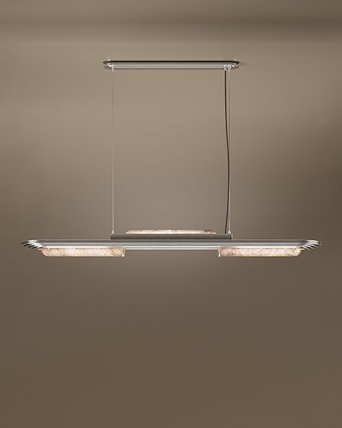 The Chrysler Suspension Lamp by Porus Studio, a luxury horizontal chandelier inspired by Art Deco architecture. It features a sleek brushed brass or silver-toned frame with aerodynamic, tiered edges reminiscent of skyscrapers. The fixture incorporates cylindrical diffusers made of backlit alabaster or translucent stone, emitting a soft, warm glow. It is suspended by two thin cables from a matching canopy against a dark, neutral backdrop.