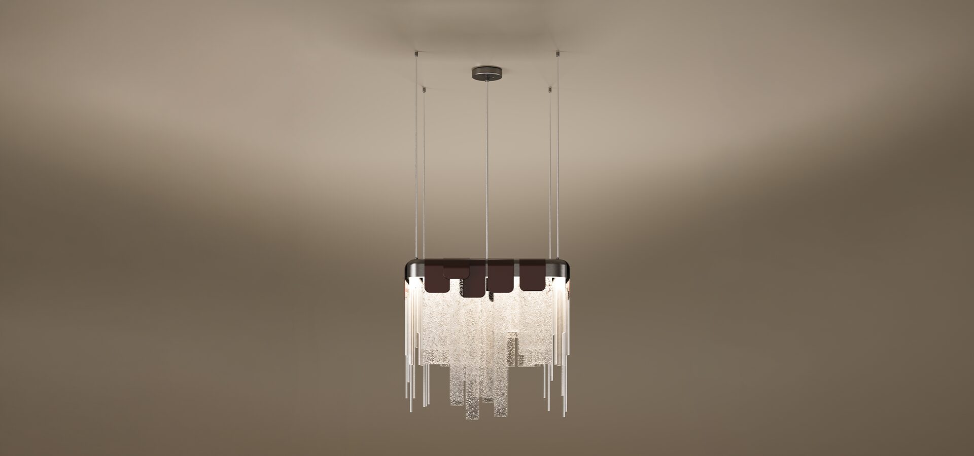 The Frostlight pendant lamp by Porus Studio, featuring a dramatic chandelier design inspired by icy formations. A rectangular metallic frame supports a cascading arrangement of textured, frosted glass panels and slender metallic rods of varying lengths, creating a shimmering tiered effect. The top is accented by dark decorative tabs, and the fixture is suspended from the ceiling by multiple thin cables against a soft, neutral gradient background.