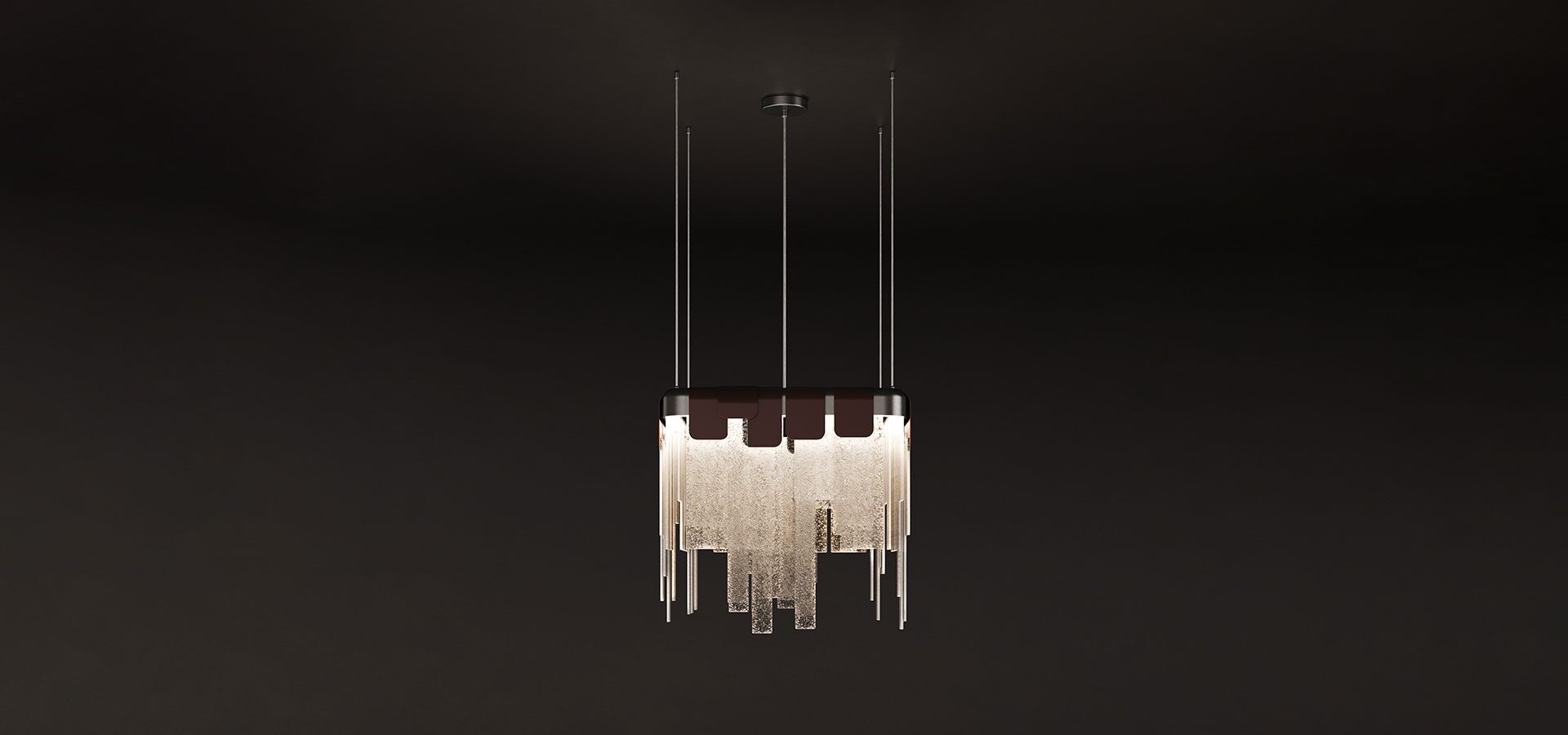 Frostlight pendant lamp illuminated against a dark background, crafted from artisanal glass and lacquered stainless steel.