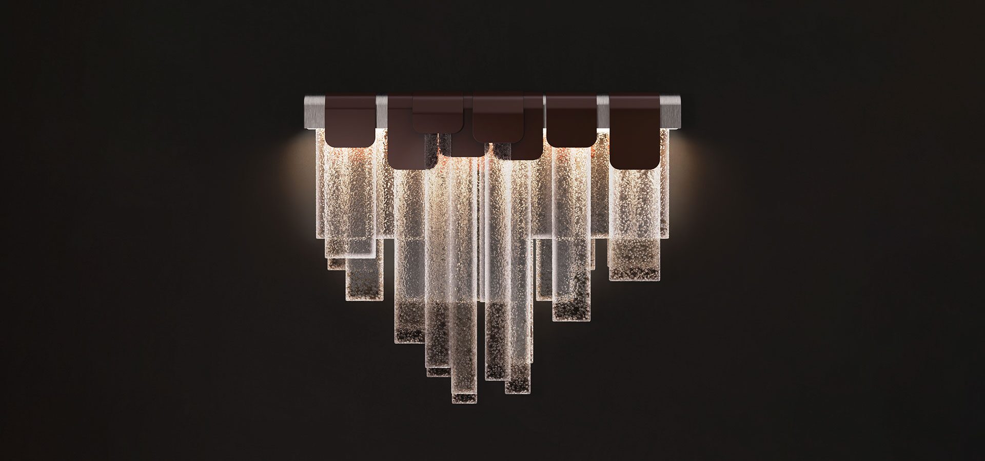 Frostlight wall lamp illuminated against a dark background, crafted from artisanal glass and lacquered stainless steel.