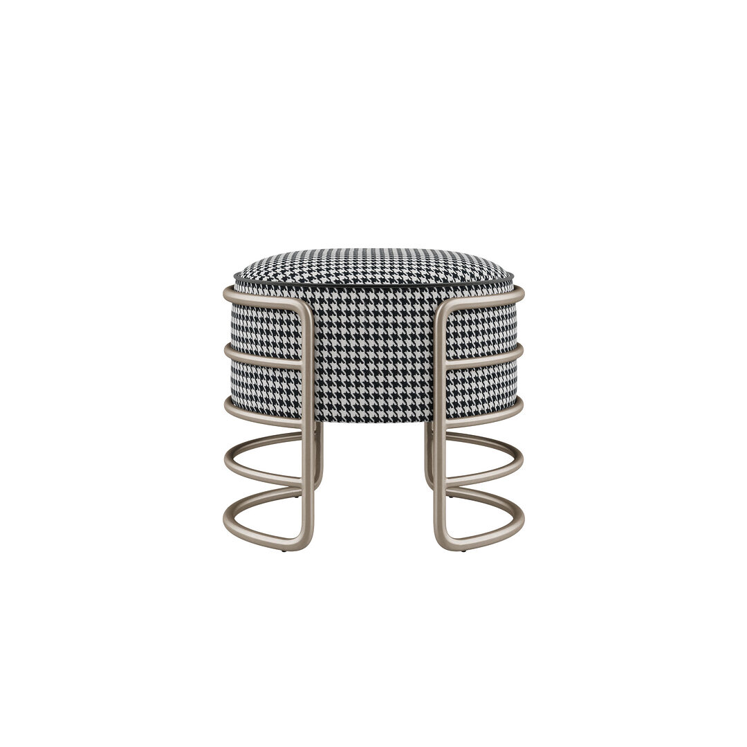 Eero stool upholstered in dedar pauline 001 fabric, finished with elastron paris black piping, and brushed champagne steel structure.