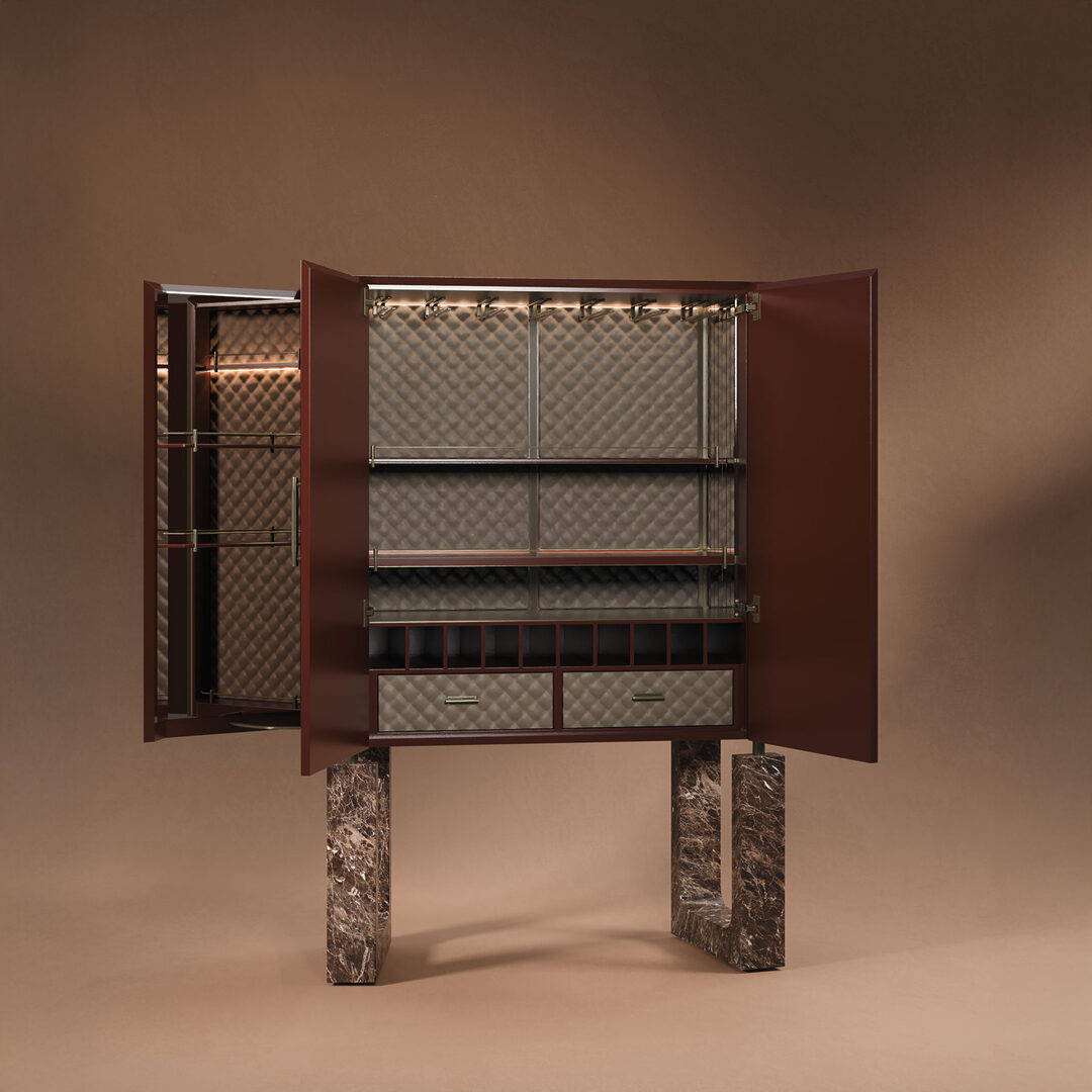 Lincoln cabinet with open doors showcasing the storage and built-in light, legs in emperador marble, and interior upholstered in leather.