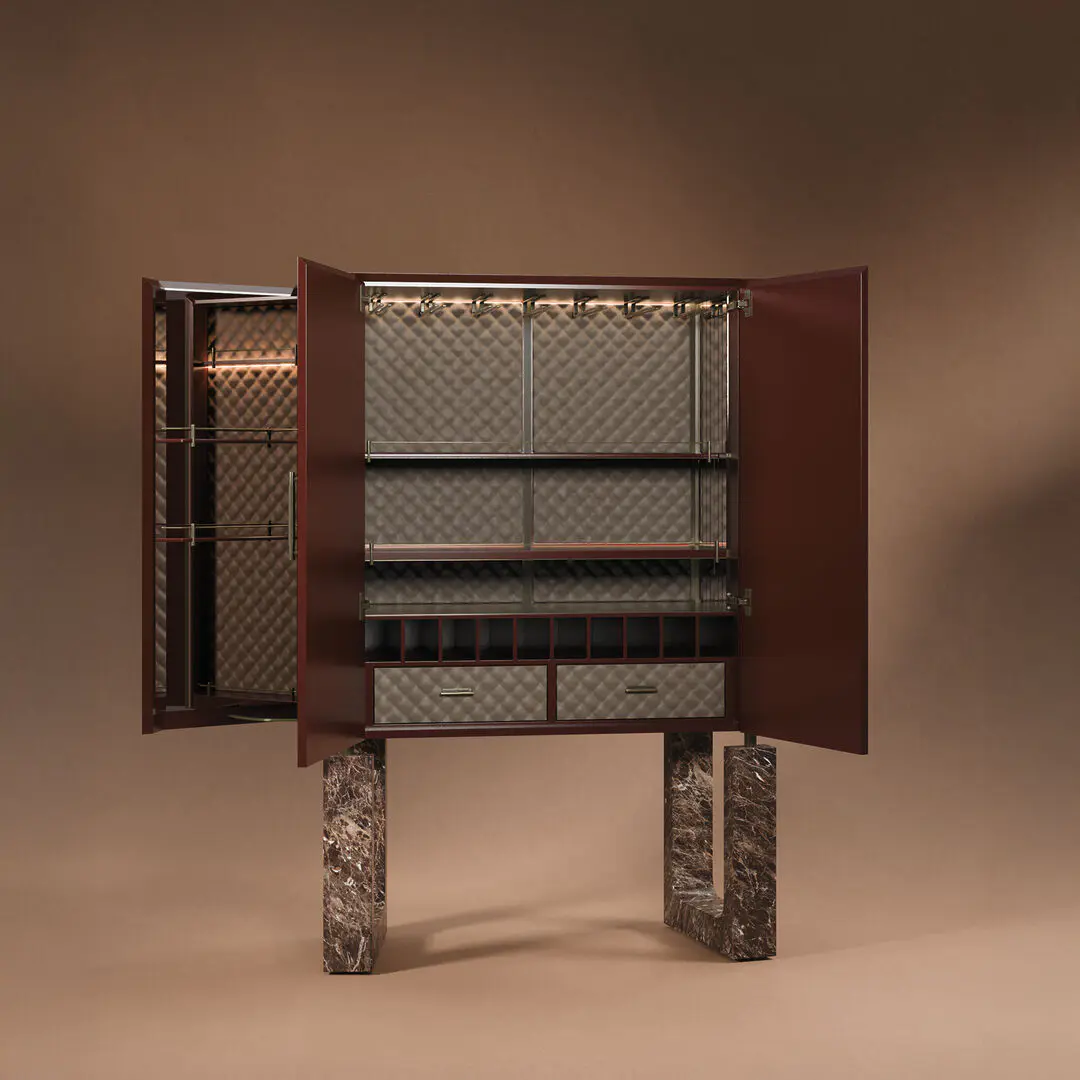 Lincoln cabinet with open doors showcasing the storage and built-in light, legs in emperador marble, and interior upholstered in leather.